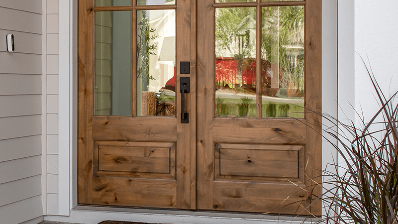 Solid wood double impact-rated front entry doors on a Florida home